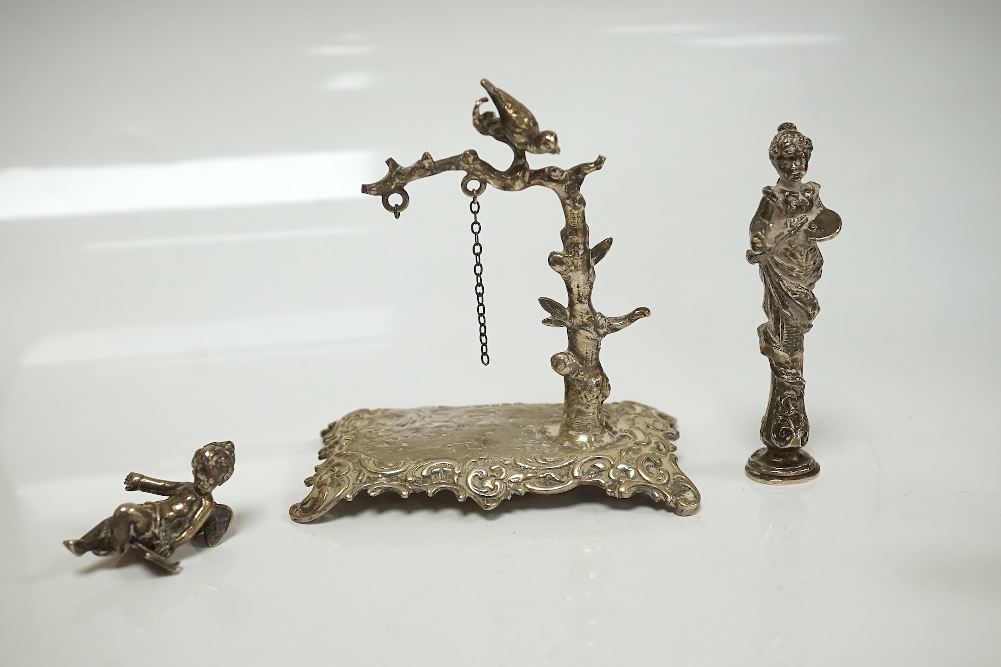 A collection of miniature silver and white metal figures and groups etc. including a swan sleigh, import marks for Chester, 1900, 41mm. Condition - poor to fair